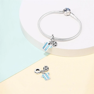 Detail of silver snake chain bracelet with football and striped jersey charm pendants