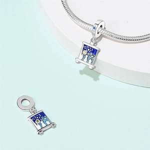 Detail view of silver artist palette charm with starry sky cat enamel on a snake chain