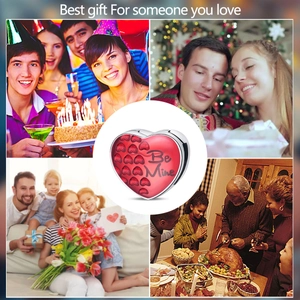 Details einer roten Herzperle mit Be Mine Gravur und Lifestyle-Geschenkhintergrund