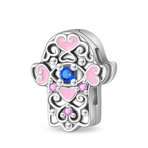 Detail of silver Hamsa charm with pink enamel heart and blue cubic zirconia stone