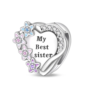 Detailed view of silver heart pendant with enamel stars and My Best sister engraving