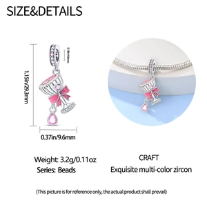 Detailed view of 925 silver beer glass charm with pink zircon and enamel bow detail