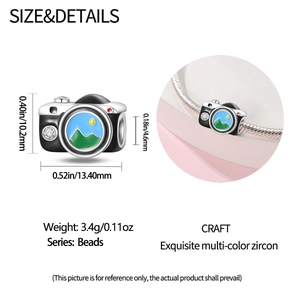 Detail of 925 silver camera charm with mountain enamel and sparkling zircon inlay
