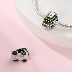 Silver off-road Jeep charm with green enamel and Just Go engraving on snake chain