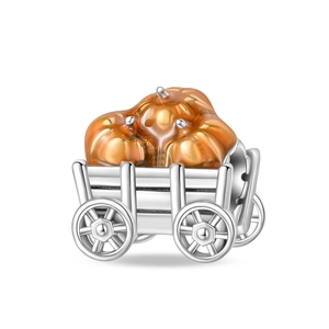 Detail showing pumpkin carriage charm in silver with orange glass pumpkin accents