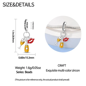 Detailed view of champagne and red lip charm with dimensions 28.9mm by 15.3mm