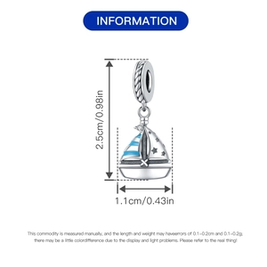 Detail showing sailboat charm with blue stripes and dimensions of 2.5cm by 1.1cm