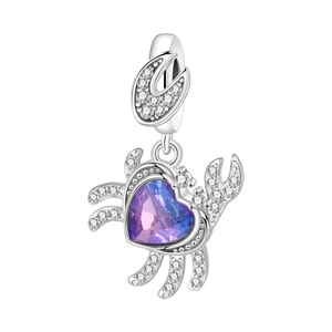 Macro view of crab charm with heart-shaped gradient crystal and zircon stones