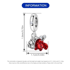 Detailed view of red enamel hermit crab charm with silver shell and zircon accents