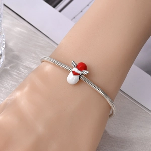 Zilveren slangenarmband met medische capsule bedel voorzien van vleugels en rood hart
