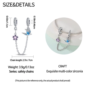 Silver safety chain charm for bracelets with purple flower and blue swallow details