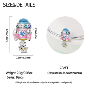 Pink enamel rocket charm with blue dome and zirconia heart details, 1.95cm height