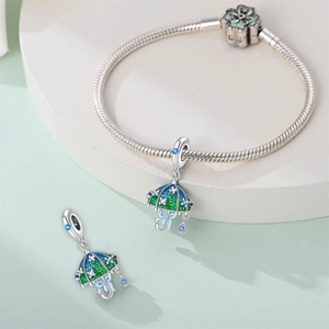 Detailed macro view of silver umbrella charm with colorful enamel and sparkling zircons