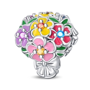 Detail of colorful enamel flower bouquet charm with crystals and a silver bow