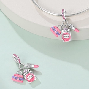 Silver bracelet charms with pink enamel perfume bottle, lipstick, and handbag pendants