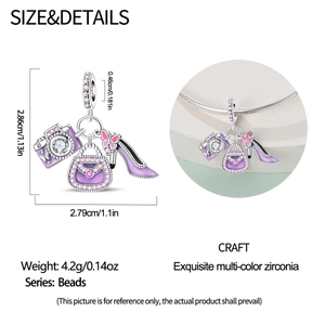 Detail view of silver camera and handbag charms on a bracelet with purple enamel and zircons