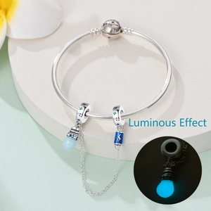 Detailed silver charm bracelet showing luminous drop pendant and Together engraving
