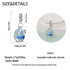 Detail showing dimensions of blue enamel perfume bottle charm with silver feather dangle