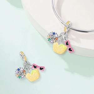 Summer cocktail themed charm with rainbow sun, yellow basket, and heart sunglasses