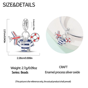Detailed view of silver nautical charms with airplane and lifesaver on snake chain