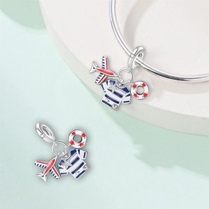 Detailed close-up of nautical charms including airplane, striped shirt, and lifebuoy beads