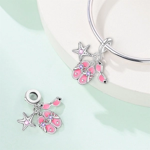 Macro detail of summer beach charms with starfish and flip flops for DIY bracelets