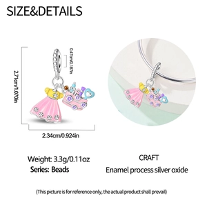 Macro view of silver and pink enamel travel charm with dimensions 2.71cm by 2.34cm