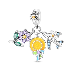 Dettaglio macro del ciondolo a tema cocktail in argento con zirconi colorati