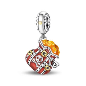 Macro detail of silver pirate treasure bag charm with red enamel and skull design
