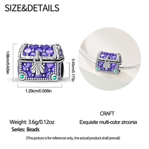 Detailed view of treasure chest bead with purple enamel and green zircon for bracelets