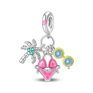 Detail of silver beach charms featuring a palm tree, pink bikini and sunglasses