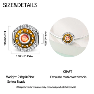 Detail view of sun charm with orange zirconia and size specs 1.16cm x 1.10cm