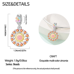 Detailed dimensions of a sun charm bead with orange stones and pink spiral design