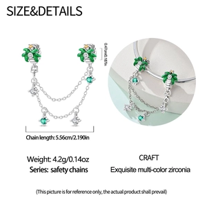 Detail of tropical palm tree safety chain charm with green enamel and colorful zirconia