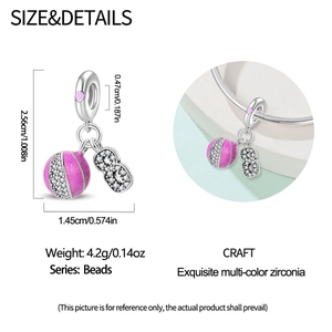 Macro detail of S925 sterling silver basketball and number 8 charm with pink cubic zirconia