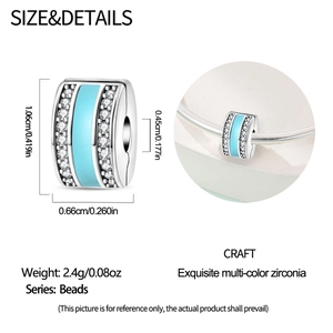 Detailed view of silver-plated bead charm with light blue enamel and sparkling cubic zirconia