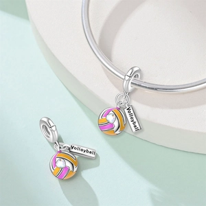 Close-up of a silver volleyball charm with colorful enamel and heart zircon detail