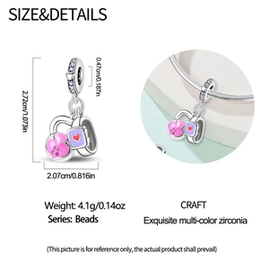 Macro detail of a 925 silver fitness charm with pink heart, purple watch and dimensions