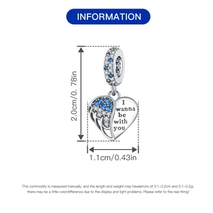 Silver heart charm with wing design, blue zircons, and I wanna be with you engraving