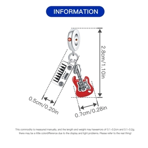 Detailed view of music themed red guitar and white piano charms with dimensions