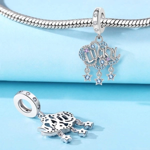 Silver lucky cloud charm with blue zircon stars on a classic snake chain bracelet