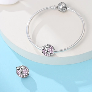 Detailed view of Princess heart charm and We belong together engraving on silver bracelet