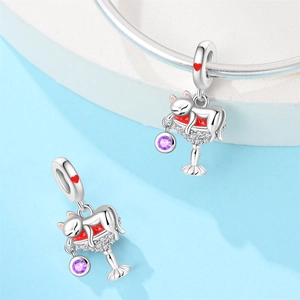 Detailed cat and wine glass charm with red enamel and purple stone on a silver bracelet