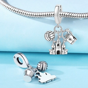 Detailed silver beach charms set featuring a castle, volleyball, and bucket on a snake chain