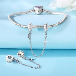Macro detail of S925 silver moon and star safety chain charm for snake bone bracelets