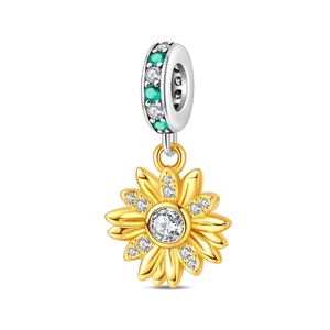 Macro shot of silver sunflower charm pendant with green gemstones and zircon inlay