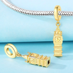 Macro view of gold Big Ben charms with heart details for DIY bracelet accessories