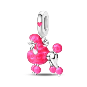 Macro view of silver poodle charm with pink enamel and detailed spiral spiral texture