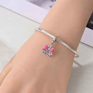 Eiffel Tower charm bracelet with pink enamel bow and micro-set cubic zirconia stones