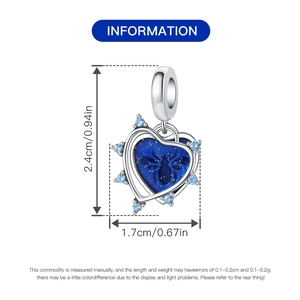 Detail view of heart bee charm with blue enamel showing dimensions 2.4cm by 1.7cm